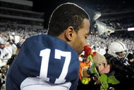 STATE COLLEGE, PA - NOVEMBER 22:  Darryl Clark #17 of the Penn State Nittany Lions smells a rose after clinching the Big Ten title and clinching a bid to the Rose Bowl after the game against the Michigan State Spartans on November 22, 2008 at Beaver Stadium in State College, Pennsylvania. Penn State won the game 49-18. (Photo by Joe Sargent/Getty Images)