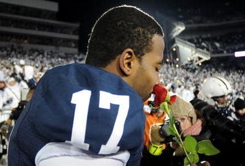 STATE COLLEGE, PA - NOVEMBER 22:  Darryl Clark #17 of the Penn State Nittany Lions smells a rose after clinching the Big Ten title and clinching a bid to the Rose Bowl after the game against the Michigan State Spartans on November 22, 2008 at Beaver Stadium in State College, Pennsylvania. Penn State won the game 49-18. (Photo by Joe Sargent/Getty Images)