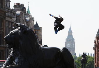 LONDON, ENGLAND - JULY 02:  A Free Runner jumps from a Lion statue during the media launch of the Barclaycard World Freerun Championships at Trafalgar Square on 2 July, 2009 in London, England.  The 2009 Barclaycard World Freerun Championships will be held in Trafalgar Square on 15th August.  (Photo by Ryan Pierse/Getty Images for Barclaycard)