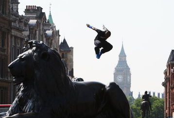 LONDON, ENGLAND - JULY 02:  A Free Runner jumps from a Lion statue during the media launch of the Barclaycard World Freerun Championships at Trafalgar Square on 2 July, 2009 in London, England.  The 2009 Barclaycard World Freerun Championships will be held in Trafalgar Square on 15th August.  (Photo by Ryan Pierse/Getty Images for Barclaycard)