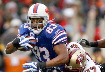 ORCHARD PARK, NY - NOVEMBER 30: Lee Evans #83  of the Buffalo Bills is tackled by Walt Harris #27 of the San Francisco 49ers  on November 30, 2008 at Ralph Wilson Stadium in Orchard Park, New York.  (Photo by Rick Stewart/Getty Images)