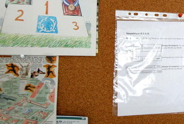 ATHENS, GREECE - AUGUST 9: A cartoon depicting bottles of chemicals winning Olympic medals (L) is pinned to a noticeboard at the Doping Control Laboratory of Athens during the final days before the start of the 2004 Olympic Games August 9, 2004 in Athens. The Olympic Games will start on Friday, August 13. (Photo by Ian Waldie/Getty Images)    *** Local Caption ***