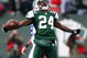 EAST RUTHERFORD, NJ - DECEMBER 14:  Darrelle Revis #24 of the New York Jets celebrates making a game saving interception in the closing minutes of regulation preserving a 31-27 win against the Buffalo Bills during their game on December 14, 2008 at Giants Stadium in East Rutherford, New Jersey.  (Photo by Al Bello/Getty Images)