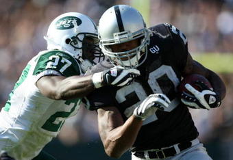 OAKLAND, CA - OCTOBER 19:  Darren McFadden #20 of the Oakland Raiders runs against Abram Elam #27 of the New York Jets during an NFL game on October 19, 2008 at the Oakland-Alameda County Coliseum in Oakland, California.  (Photo by Jed Jacobsohn/Getty Images)