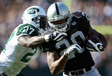 OAKLAND, CA - OCTOBER 19:  Darren McFadden #20 of the Oakland Raiders runs against Abram Elam #27 of the New York Jets during an NFL game on October 19, 2008 at the Oakland-Alameda County Coliseum in Oakland, California.  (Photo by Jed Jacobsohn/Getty Images)