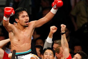 LAS VEGAS - MAY 02:  Manny Pacquiao of the Philippines celebrates after knocking out Ricky Hatton of England in the second round of their junior welterweight title fight at the MGM Grand Garden Arena May 2, 2009 in Las Vegas, Nevada.  (Photo by Ethan Miller/Getty Images)