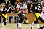 PITTSBURGH - JANUARY 18:  Running back Ray Rice #27 of the Baltimore Ravens runs the ball against linebacker linebackers Lawrence Timmons #94 and James Harrison #92 of the Pittsburgh Steelers during the second quarter of the AFC championship game on January 18, 2009 at Heinz Field in Pittsburgh, Pennsylvania.  (Photo by Gregory Shamus/Getty Images)