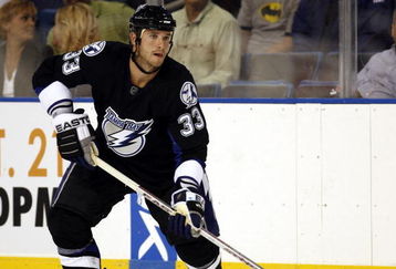 TAMPA, FL - SEPTEMBER 19: Bryce Lampman #33 of the Tampa Bay Lightning moves the puck against the Dallas Stars during a NHL preseason game at the St. Pete Times Forum on September 19, 2007 in Tampa, Florida. (Photo by Eliot J. Schechter/Getty Images)