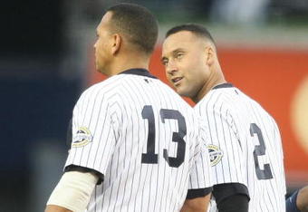 NEW YORK - JUNE 03:  Derek Jeter #2 of the New York Yankees talks to teammate Alex Rodriguez #13  in the field against the Texas Rangers on June 3, 2009 at Yankee Stadium in the Bronx borough of New York City.  (Photo by Nick Laham/Getty Images)