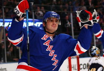 NEW YORK - MARCH 21: Nikolai Zherdev #13 of the New York Rangers celebrates his assist as Sean Avery #16 (R) celebrates scoring the goal against the Buffalo Sabres during their game on March 21, 2009 at Madison Square Garden in New York City.  (Photo by Chris McGrath/Getty Images)