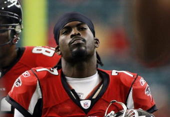 ATLANTA - DECEMBER 24:   Quarterback Michael Vick #7 of the Atlanta Falcons walks off against the Carolina Panthers December 24, 2006 at The Georgia Dome  in Atlanta,Georgia  (Photo by Marc Serota/Getty Images)