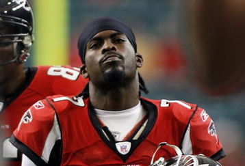 ATLANTA - DECEMBER 24:   Quarterback Michael Vick #7 of the Atlanta Falcons walks off against the Carolina Panthers December 24, 2006 at The Georgia Dome  in Atlanta,Georgia  (Photo by Marc Serota/Getty Images)