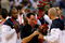 BEIJING - AUGUST 24:  Head coach Mike Krzyzewski of the United States receives a gold medal from a player after the United States defeated Spain in the gold medal game during Day 16 of the Beijing 2008 Olympic Games at the Beijing Olympic Basketball Gymnasium on August 24, 2008 in Beijing, China.  (Photo by Harry How/Getty Images)
