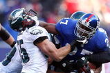 EAST RUTHERFORD, NJ - JANUARY 11:  Brandon Jacobs #27 of the New York Giants runs against Stewart Bradley #55 of the Philadelphia Eagles during the NFC Divisional Playoff Game on January 11, 2009 at Giants Stadium in East Rutherford, New Jersey.  (Photo by Al Bello/Getty Images)