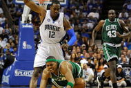 ORLANDO, FL - MAY 14:  Dwight Howard #12 of the Orlando Magic becomes tangled with Paul Pierce #34 of the Boston Celtics in Game Six of the Eastern Conference Semifinals during the 2009 NBA Playoffs at Amway Arena on May 14, 2009 in Orlando, Florida.  NOTE TO USER: User expressly acknowledges and agrees that, by downloading and/or using this Photograph, user is consenting to the terms and conditions of the Getty Images License Agreement.  (Photo by Sam Greenwood/Getty Images)