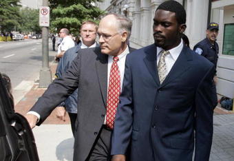 RICHMOND, VA - AUGUST 27:  Atlanta Falcons quarterback Michael Vick (R) leaves federal court with attorney Lawrence Woodward August 27, 2007 in Richmond, Viriginia. Vick pleaded guilty to a federal dogfighting charge.  (Photo by Steve Helber-Pool/Getty Images)