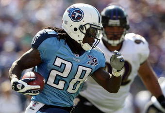 BALTIMORE - OCTOBER 05:  Chris Johnson #28 of the Tennessee Titans rushes against the Baltimore Ravens on October 5, 2008 at M&T Bank Stadium in Baltimore, Maryland.  (Photo by Nick Laham/Getty Images)