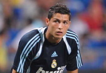MADRID, SPAIN - JULY 26:  Cristiano Ronaldo of Real Madrid warms up before his debut home match at the Santiago Bernabeu stadium during the Peace Cup match between Real Madrid and Al-Ittihad on July 26, 2009 in Madrid, Spain.  (Photo by Denis Doyle/Getty Images)