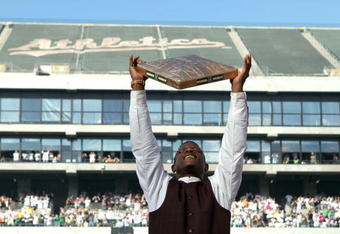 OAKLAND, CA - AUGUST 01:  Hall of Fame baseball player Rickey Henderson holds up a golden base during a ceremony to retire his number 24 by the Oakland Athletics before the start of the game against the Toronto Blue Jays August 1, 2009 at the McAfee Coliseum in Oakland, California. Henderson was inducted into the Baseball Hall of Fame one week ago.  (Photo by Justin Sullivan/Getty Images)