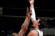 CHARLOTTE, NC - MARCH 23:  Primoz Brezec #7 of the Charlotte Bobcats shoots over Amare Stoudemire #32 of the Phoenix Sun on March 23, 2005 at the Charlotte Coliseum in Charlotte, North Carolina. The Suns defeated the Bobcats 120-105.  NOTE TO USER: User expressly acknowledges and agrees that, by downloading and/or using this Photograph, user is consenting to the terms and conditions of the Getty Images License Agreement. (Photo by Streeter Lecka/Getty Images)