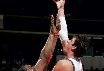 CHARLOTTE, NC - MARCH 23:  Primoz Brezec #7 of the Charlotte Bobcats shoots over Amare Stoudemire #32 of the Phoenix Sun on March 23, 2005 at the Charlotte Coliseum in Charlotte, North Carolina. The Suns defeated the Bobcats 120-105.  NOTE TO USER: User expressly acknowledges and agrees that, by downloading and/or using this Photograph, user is consenting to the terms and conditions of the Getty Images License Agreement. (Photo by Streeter Lecka/Getty Images)
