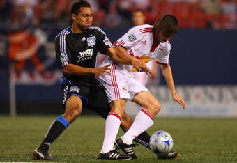 EAST RUTHERFORD, NJ - MAY 08:  Albert Celades #5  of the New York Red Bulls battles for the ball against Arturo Alvarez #10 of the San Jose Earthquakes at Giants Stadium in the Meadowlands on May 8, 2009 in East Rutherford, New Jersey.  (Photo by Mike Stobe/Getty Images for New York Red Bull)