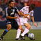 EAST RUTHERFORD, NJ - MAY 08:  Albert Celades #5  of the New York Red Bulls battles for the ball against Arturo Alvarez #10 of the San Jose Earthquakes at Giants Stadium in the Meadowlands on May 8, 2009 in East Rutherford, New Jersey.  (Photo by Mike Stobe/Getty Images for New York Red Bull)