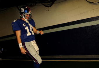 IRVING, TX - DECEMBER 14:  Quarterback Eli Manning #10 of the New York Giants walks down the tunnel to the field before a game against the Dallas Cowboys at Texas Stadium on December 14, 2008 in Irving, Texas.  (Photo by Ronald Martinez/Getty Images)