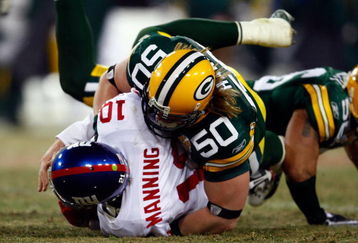 GREEN BAY, WI - JANUARY 20:  Linebacker AJ Hawk #50 of the Green Bay Packers sacks quarterback Eli Manning #10 of the New York Giants during the NFC championship game on January 20, 2008 at Lambeau Field in Green Bay, Wisconsin. The Giants defeated the Packers 23-20 in overtime to advance to the Superbowl XLII.  (Photo by Jamie Squire/Getty Images)