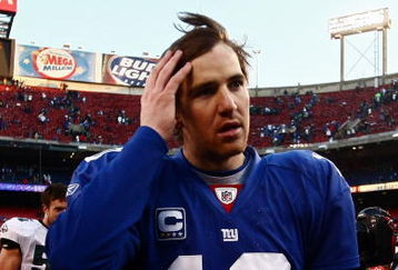 EAST RUTHERFORD, NJ - JANUARY 11:  Eli Manning #10 of the New York Giants walks off the field after losing to the Philadelphia Eagles during the NFC Divisional Playoff Game on January 11, 2009 at Giants Stadium in East Rutherford, New Jersey.The Eagles won the game by a score of 23-11.  (Photo by Chris McGrath/Getty Images)