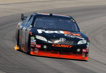 LONG POND, PA - AUGUST 03:  Denny Hamlin races the #11 FedEx Express Toyota during the NASCAR Sprint Cup Series Sunoco Red Cross Pennsylvania 500 at the Pocono Raceway on August 3, 2009 in Long Pond, Pennsylvania.  (Photo by Doug Pensinger/Getty Images)