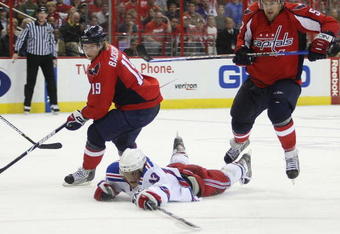 WASHINGTON - APRIL 18: Nikolai Zherdev #13 of the New York Rangers skates against Nicklas Backstrom #19 (L) and Mike Green #52 (R) of the Washington Capitals during Game Two of the Eastern Conference Quarterfinal Round of the 2009 NHL Stanley Cup Playoffs at Verizon Center on April 18, 2009 in Washington, DC. (Photo by Bruce Bennett/Getty Images)