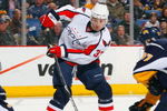 BUFFALO, NY - DECEMBER 30:  Alexandre Giroux #33 of the Washington Capitals deflects the puck on goal as goaltender Ryan Miller #30 of the Buffalo Sabres looks to make the save during their NHL game on December 30, 2008 at HSBC Arena in Buffalo, New York. The Capitals defeated the Sabres 4-2. (Photo by Rick Stewart/Getty Images)