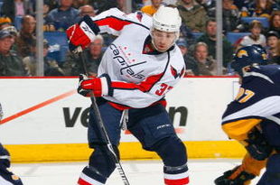BUFFALO, NY - DECEMBER 30:  Alexandre Giroux #33 of the Washington Capitals deflects the puck on goal as goaltender Ryan Miller #30 of the Buffalo Sabres looks to make the save during their NHL game on December 30, 2008 at HSBC Arena in Buffalo, New York. The Capitals defeated the Sabres 4-2. (Photo by Rick Stewart/Getty Images)