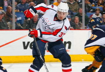 BUFFALO, NY - DECEMBER 30:  Alexandre Giroux #33 of the Washington Capitals deflects the puck on goal as goaltender Ryan Miller #30 of the Buffalo Sabres looks to make the save during their NHL game on December 30, 2008 at HSBC Arena in Buffalo, New York. The Capitals defeated the Sabres 4-2. (Photo by Rick Stewart/Getty Images)