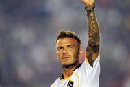 PASADENA, CA - AUGUST 01:  David Beckham #23 of the Los Angeles Galaxy waves at his family after scoring a goal on a free kick against FC Barcelona during the first half of the friendly soccer match at the Rose Bowl on August 1, 2009 in Pasadena, California.  (Photo by Kevork Djansezian/Getty Images)