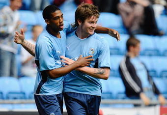 COVENTRY, ENGLAND - AUGUST 02:  Aron Gunnarsson of Coventry celebrates his late equaliser with team mate Shaun Jeffers during the pre season friendly match between Coventry City and Everton at the Ricoh Arena on August 2, 2009 in Coventry, England.  (Photo by Michael Regan/Getty Images)