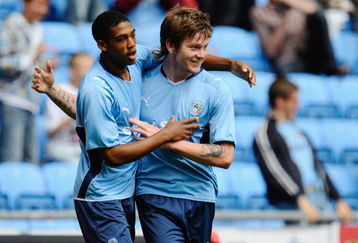 COVENTRY, ENGLAND - AUGUST 02:  Aron Gunnarsson of Coventry celebrates his late equaliser with team mate Shaun Jeffers during the pre season friendly match between Coventry City and Everton at the Ricoh Arena on August 2, 2009 in Coventry, England.  (Photo by Michael Regan/Getty Images)