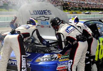 LONG POND, PA - AUGUST 03:  The #48 crew changes a carburetor on the Lowes Chevrolet, driven by Jimmie Johnson, during the NASCAR Sprint Cup Series Sunoco Red Cross Pennsylvania 500 at the Pocono Raceway on August 3, 2009 in Long Pond, Pennsylvania.  (Photo by Rusty Jarrett/Getty Images for NASCAR)