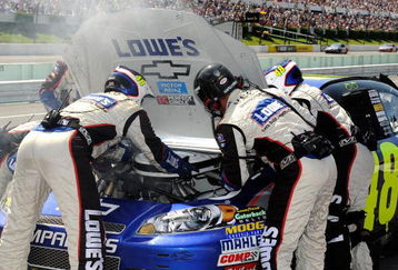 LONG POND, PA - AUGUST 03:  The #48 crew changes a carburetor on the Lowes Chevrolet, driven by Jimmie Johnson, during the NASCAR Sprint Cup Series Sunoco Red Cross Pennsylvania 500 at the Pocono Raceway on August 3, 2009 in Long Pond, Pennsylvania.  (Photo by Rusty Jarrett/Getty Images for NASCAR)
