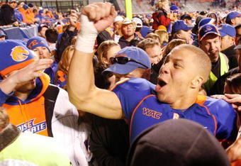 BOISE, ID - NOVEMBER 28:  Ian Johnson #41 of the Boise State Broncos celebrates an undefeated season after their game against the Fresno State Bulldogs on November 28, 2008 at Bronco Stadium in Boise, Idaho.  (Photo by Otto Kitsinger III/Getty Images)