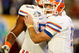 MIAMI - JANUARY 08:  Tim Tebow #15 (R) and Carl Johnson #57 of the Florida Gators celebrate after Tebow threw a 20-yard touchdown pass to Louis Murphy #9 in the second quarter against the Oklahoma Sooners during the FedEx BCS National Championship game at Dolphin Stadium on January 8, 2009 in Miami, Florida.  (Photo by Marc Serota/Getty Images)