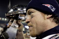 JACKSONVILLE, F - FEBRUARY 6:  Linebacker Larry Izzo #53 of the New England Patriots celebrates with the Lombardi Trophy after defeating the Philadelphia Eagles in Super Bowl XXXIX at Alltel Stadium on February 6, 2005 in Jacksonville, Florida.  The Patriots defeated the Eagles 24-21.  (Photo by Brian Bahr/Getty Images)