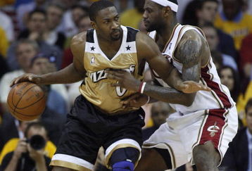 CLEVELAND - APRIL 21:  Gilbert Arenas #0 of the Washington Wizards tries to get around LeBron James #23 of the Cleveland Cavaliers in Game Two of the Eastern Conference Quarterfinals during the 2008 NBA Playoffs at Quicken Loans Arena April 21, 2008 in Cleveland, Ohio.  NOTE TO USER: User expressly acknowledges and agrees that, by downloading and or using this photograph, User is consenting to the terms and conditions of the Getty Images License Agreement.  (Photo by Gregory Shamus/Getty Images)