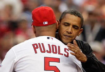 ST. LOUIS, MO - JULY 14:  President Barack Obama hugs National League All-Star Albert Pujols of the St. Louis Cardinals after throwing the first pitch before the 2009 MLB All-Star Game at Busch Stadium on July 14, 2009 in St Louis, Missouri. (Photo by Jamie Squire/Getty Images)