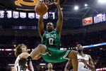 CLEVELAND - MAY 10:  Leon Powe #0 of the Boston Celtics dunk against Anderson Varejao #17 and Joe Smith #32 of the Cleveland Cavaliers in Game Three of the 2008 NBA Eastern Conference Semifinals on May 10, 2008 at the Quicken Loans Arena in Cleveland, Ohio. NOTE TO USER: User expressly acknowledges and agrees that, by downloading and or using this photograph, User is consenting to the terms and conditions of the Getty Images License Agreement.  (Photo by Gregory Shamus/Getty Images)