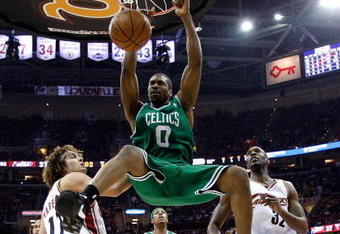 CLEVELAND - MAY 10:  Leon Powe #0 of the Boston Celtics dunk against Anderson Varejao #17 and Joe Smith #32 of the Cleveland Cavaliers in Game Three of the 2008 NBA Eastern Conference Semifinals on May 10, 2008 at the Quicken Loans Arena in Cleveland, Ohio. NOTE TO USER: User expressly acknowledges and agrees that, by downloading and or using this photograph, User is consenting to the terms and conditions of the Getty Images License Agreement.  (Photo by Gregory Shamus/Getty Images)