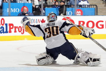 TORONTO - APRIL 8:  Goalie Ryan Miller #30 of the Buffalo Sabres blocks the puck against the Toronto Maple Leafs during their NHL game at the Air Canada Centre on April 8, 2009 in Toronto, Ontario. (Photo by: Dave Sandford/Getty Images)