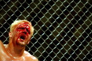 26 Oct 2001:  Jeff Jarrett feels the pain during the cage fight bout during the WWA Wrestling 'Inception'  fight night held at the Sydney Superdome, Sydney, Australia.  DIGITAL IMAGE Mandatory Credit: Chris McGrath/ALLSPORT