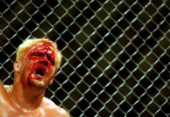 26 Oct 2001:  Jeff Jarrett feels the pain during the cage fight bout during the WWA Wrestling 'Inception'  fight night held at the Sydney Superdome, Sydney, Australia.  DIGITAL IMAGE Mandatory Credit: Chris McGrath/ALLSPORT